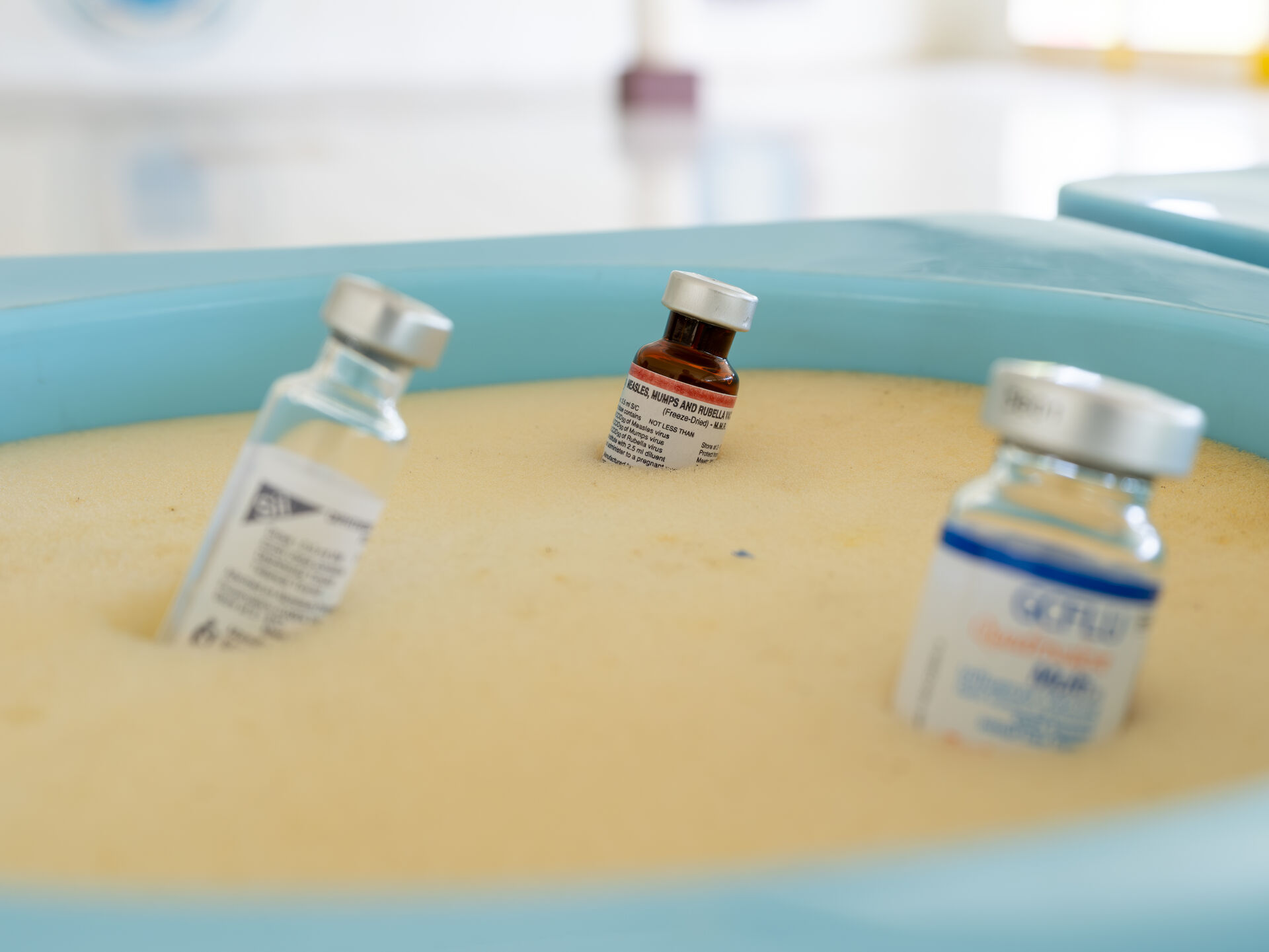 3 vaccine vials stored in cold box