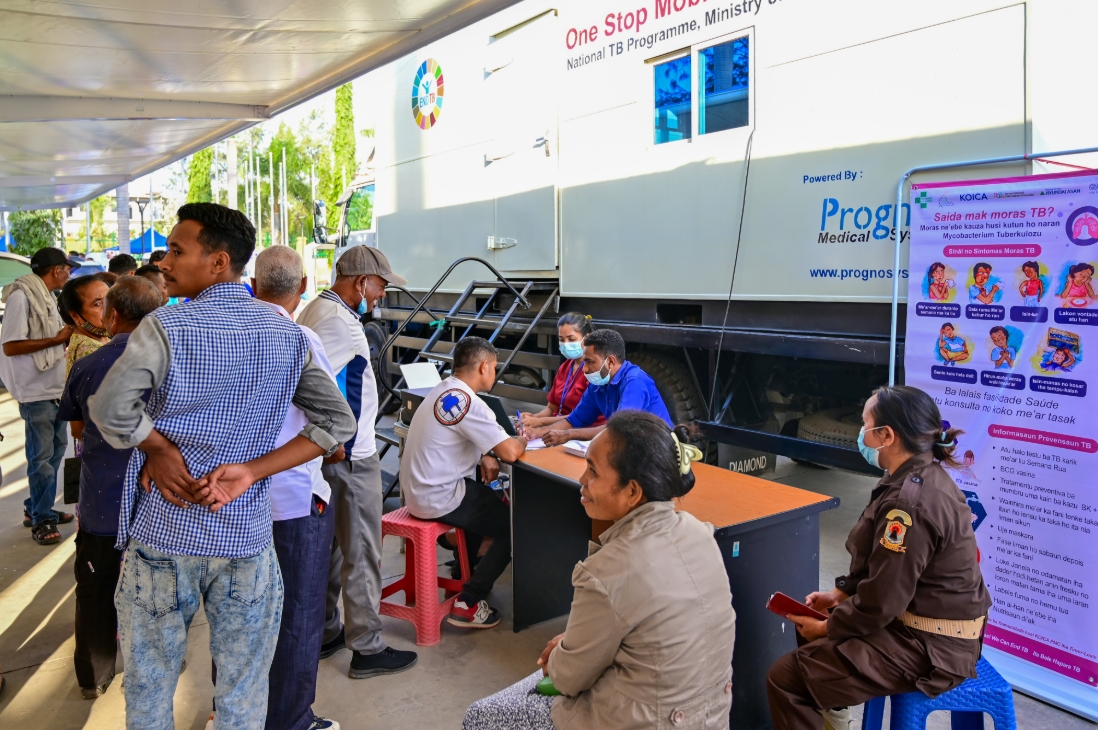 People line up for a test near the mobile TB screening van in Timor Leste